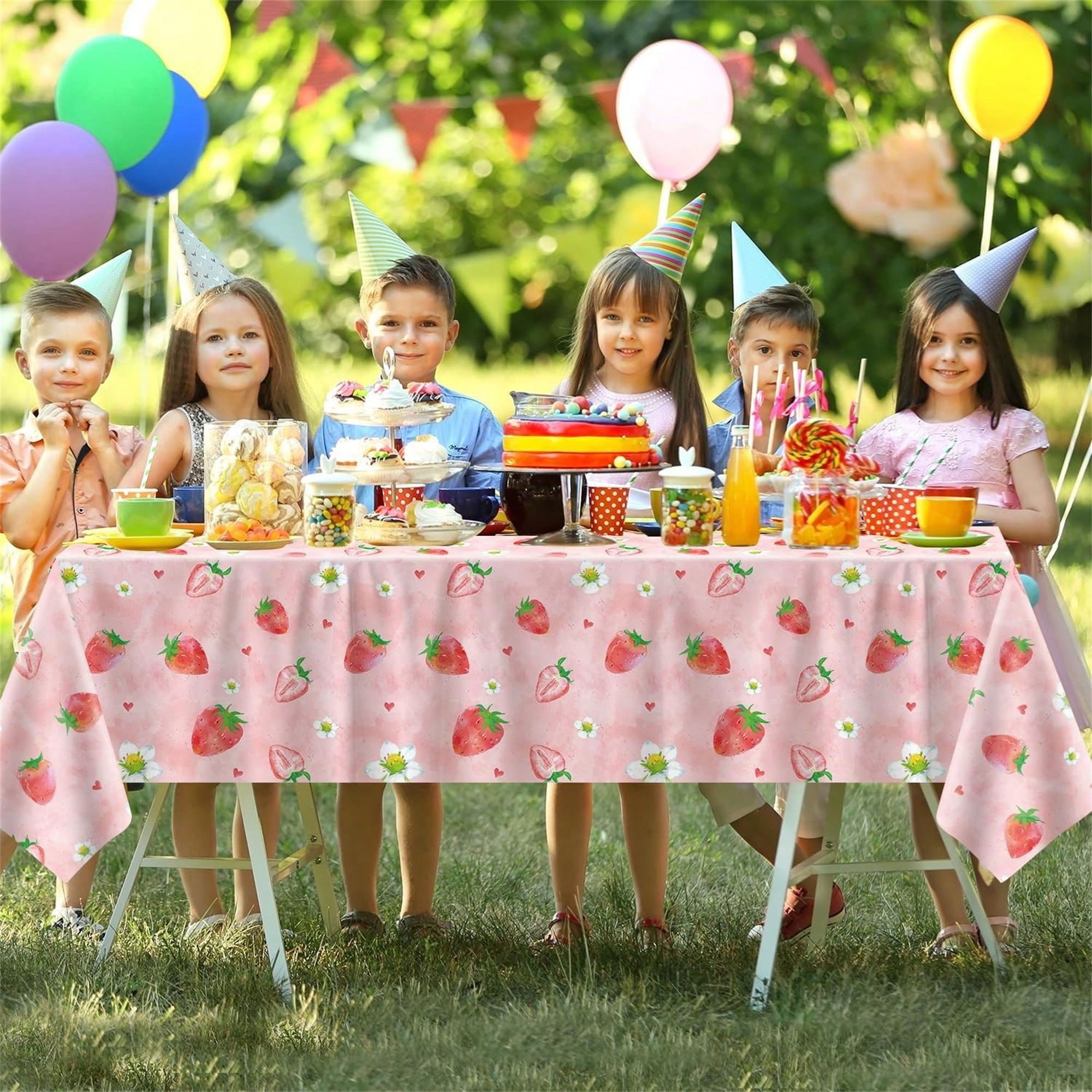 Strawberry & Cherry Party Tablecloth styled for a home or retail display